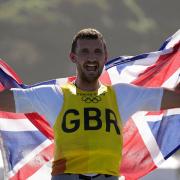 Huntingdon\'s Giles Scott celebrates his gold medal in the men\'s finn class during the sailing regatta at the Tokyo 2020 Olympic Games.
