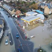 Cambridgeshire County Council say they have cleared thousands of drains - but residents are still concerned. Pictured is flooding in St Neots at Christmas.