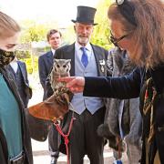 Princess Katrina with one of the owls and staff at the Raptor Foundation.