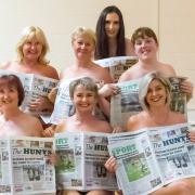 Ladies from St Neots use copies of The Hunts Post to cover their modesty. Front row (left to right): Louisa Hewitt, Lynne Otto and Belinda Hicks. Top row (left to right): Gill Brace, Lesley Darlow and Amanda Dibben. Katie Kitson is at the back.