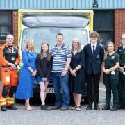 Daisy Webb (fifth from left), with her mum, Lisa, and dad, John, meet the team who saved her life in April.