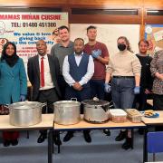 Volunteers from Huntingdonshire Community Group, alongside staff from the district council and Mamas Indian restaurant who served the food.

MAMAS Indian restaurant