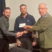 Revamp the Ramp chairman Chris Hatch and director Sam Curtin received a £2,000 cheque from Rotary Club president Mike Kingdon.