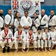 Huntingdon and St Ives Tang Soo Do competitors and instructors celebrate trophy success at the Great Britain Tang Soo Do Championships.