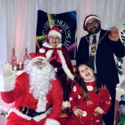 Lilly having fun at the Santa party with Mayor of Huntingdon, Cllr David Landon Cole and Mr and Mrs Claus.