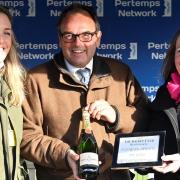 From left to right: Clare Ascroft, Chris' daughter; Alan King, winning trainer in the Pertemps Network Chris Ascroft Memorial Novices’ Handicap Chase, and Zoe Ascroft, Chris' widow.