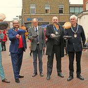 The mayors and chairs give their pancakes a flip ahead of the famous 'Chain Gang' race at the Huntingdon Pancake Flipathon.
