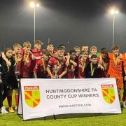 St Neots Town under-18s celebrate winning the Huntingdonshire County Youth Cup for a fourth time in five years.