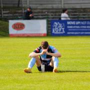 Many St Neots players were disconsolate at the final whistle, which confirmed the team's relegation.
