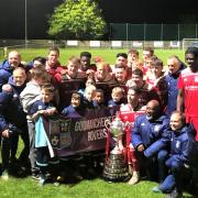 The Rovers and the coaching staff celebrate a fine end to the season with the Hinchingbrooke Cup trophy on May 5.