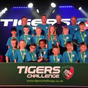 The St Neots under 10s squad, and coaches Ian Wallis, Andrew Kinglake and Gareth Mount, with their trophy and players’ medals presented by former Irish international and Leicester Tigers player Geordan Murphy.