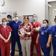 Sallie Crawley (centre) with Dr Will Davies (fourth from left) and members of the catheter lab and cardiology team at Royal Papworth Hospital.