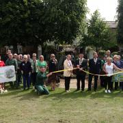 Representatives from local community groups involved in Huntingdon in Bloom, watched the cutting of the ribbon by Cllr Karl Brockett, Deputy Mayor of Huntingdon, at the 3D display of the Flying Scotsman in Huntingdon.