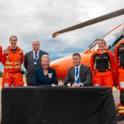 Magpas Air Ambulance signs the Armed Forces Covenant, alongside armed forces personnel and the Lord Lieutenant of Cambridgeshire, Julie Spence OBE.