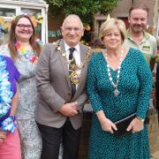 The Manor staff and Notcutts’ horticulturalists join Cllr Phillip Pearce, Mayor of Huntingdon, in officially unveiling their garden renovation project for care home residents to enjoy.