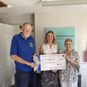 Bernard Dable presenting the cheque to Georgina Forbes and Hilary Thomson (centre) of Cornerstone Care in Confidence.