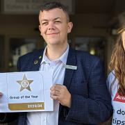 A delighted Jason Missen, the deputy general manager at The Golden Lion Hotel, and colleagues Victoria Haynes (L) and Alexia Lixandru (R) celebrated with a copy of the awards certificate.