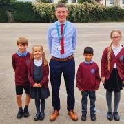 Somersham Primary School headteacher Jonathan Clarke with pupils from the school.