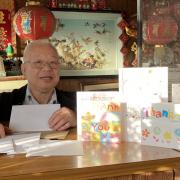 Lee Wong with his retirement cards