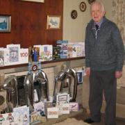 100-year-old Ed Kelly in his lounge with his birthday cards