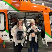Molly and her mum Jan with the twins on a visit to the Magpas headquarters.