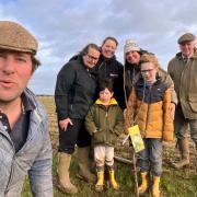 Farmer Tom Martin, front left, with some of the volunteers on one of the tree planting days.