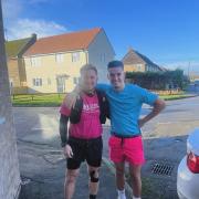 Daniel Peck (left) with Tom Wood, one of the many runners who supported Daniel during his 496 challenge.