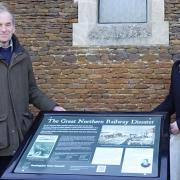 Mayor of Huntingdon, Cllr Phil Pearce, and resident Charles Saunders unveiled the interpretation board