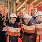 The mayor and mayoress with John Dillon from David Wilson Homes and pupils.