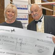 Christine Taylor (Mick Taylor's widow) and Geoff Richardson celebrated the donation to the Campol Boxing Club.