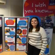 EACH Senior Digital Comms Coordinator Lois Livoti with the ‘I wish you knew...’ displays.