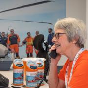Volunteer Rosemary on the Magpas Air Ambulance welcome desk.