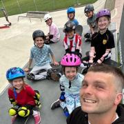 Jason Emery, skateboard instructor at Let’s Go Skate C.I.C., pictured with some of the group's students.