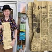 Joshua O'Keeffe wearing the bowler cap and holding the 1949 edition of The Hunts Post.