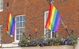 Two pride flags flying from the Huntingdon Town Hall for pride month.