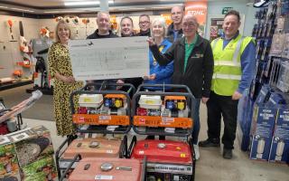 The Rotary Club of St Neots St Mary's handed over an £840 cheque to the Hire or Buy Group in St Neots with the generators pictured and ready to be shipped.