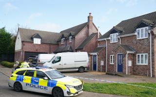 Police at the scene in The Row in Sutton, near Ely, Cambridgeshire, where police found the body of a 57-year-old man who had died from gunshot wounds on Wednesday evening.