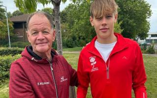 Former principal of Bushfield Academy in Peterborough, Eric Winstone, is also an English Athletics running coach and presented Liam with his new pair of running shoes.