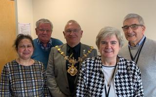 (L-R): Mike Baker - Chair of Board of Trustees, Mayor Cllr. Pearce, Anthony Clarke - Trustee, [front]Tripti Woolf - Huntingdon Office Manager, Michelle Panting - Volunteer Car Scheme Administrator